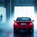 Car moving quickly through a wash bay